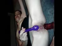 Dude probes his young lovers asshole with a long sex toy while she pleasures her swollen clit