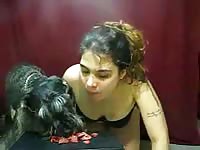 Filthy amateur live streaming webcam model on all fours eating dog food with her furry friend