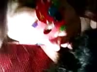 Masked amateur young whore tries or cock sucking skills out on the family pet in this video