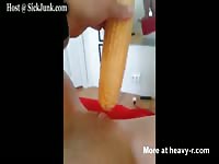 Horny young perfectly shaved tramp uses corn to pleasure her dick craving moist cunt here