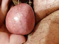 Nasty dude inflicting pain to his dick with a pin